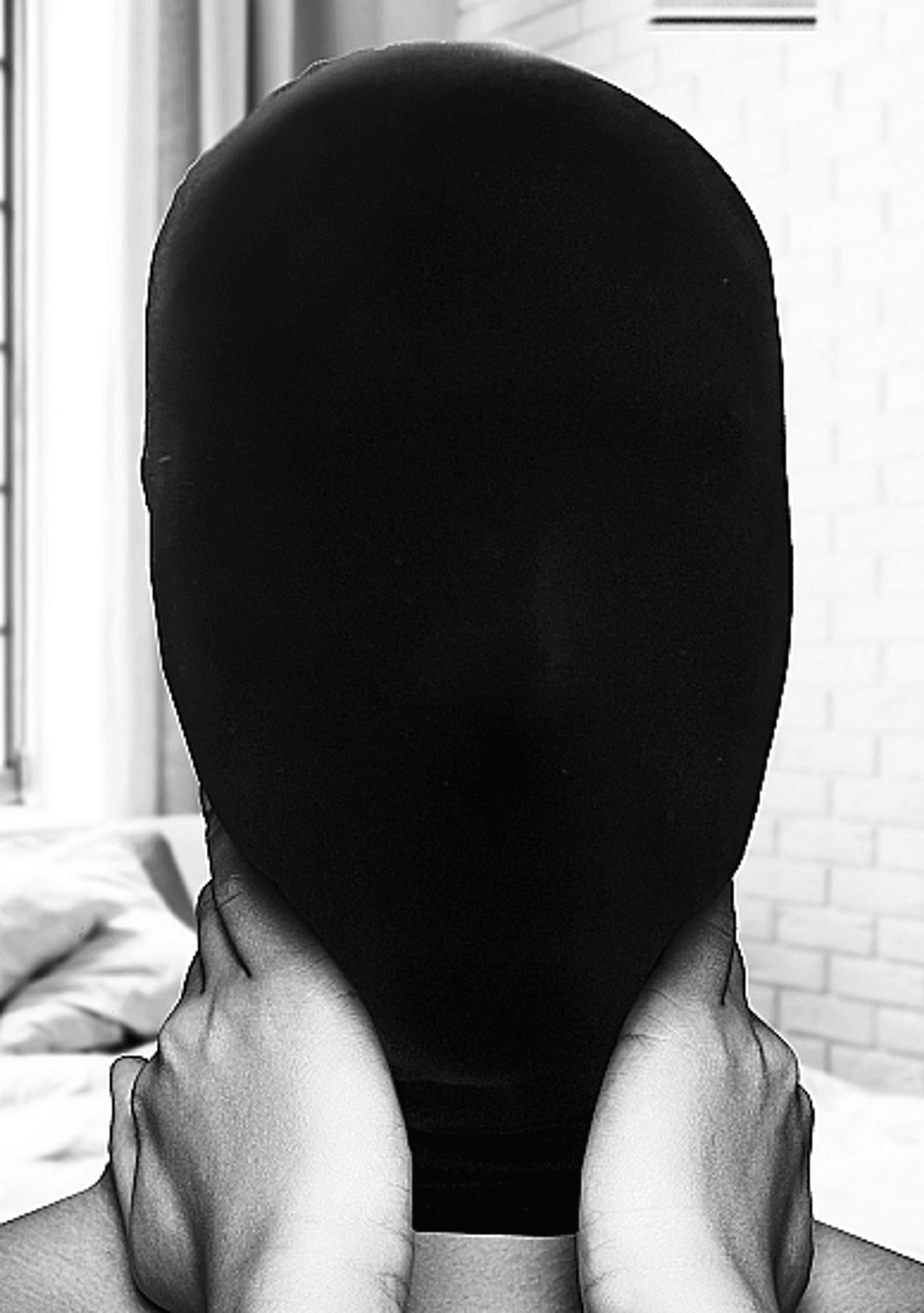 B&W SUBJUGATION MASK ALLOWS JUST A HINT OF LIGHT